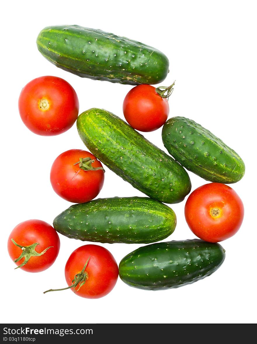 Cucumbers and tomatoes isolated on white