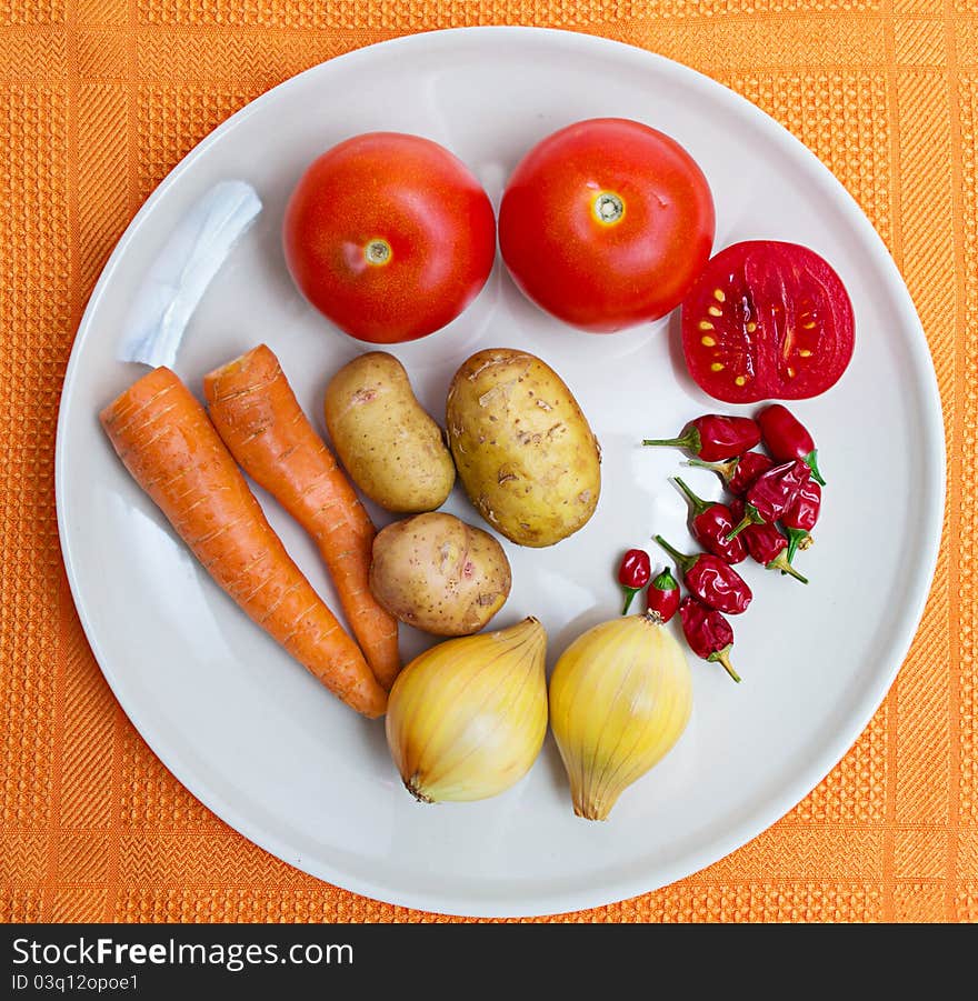 Fresh vegetables on white plate