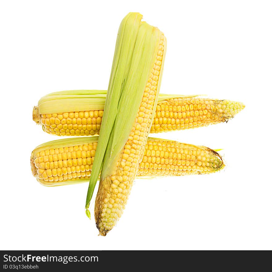 Three yellow cThree yellow corn cob isolated