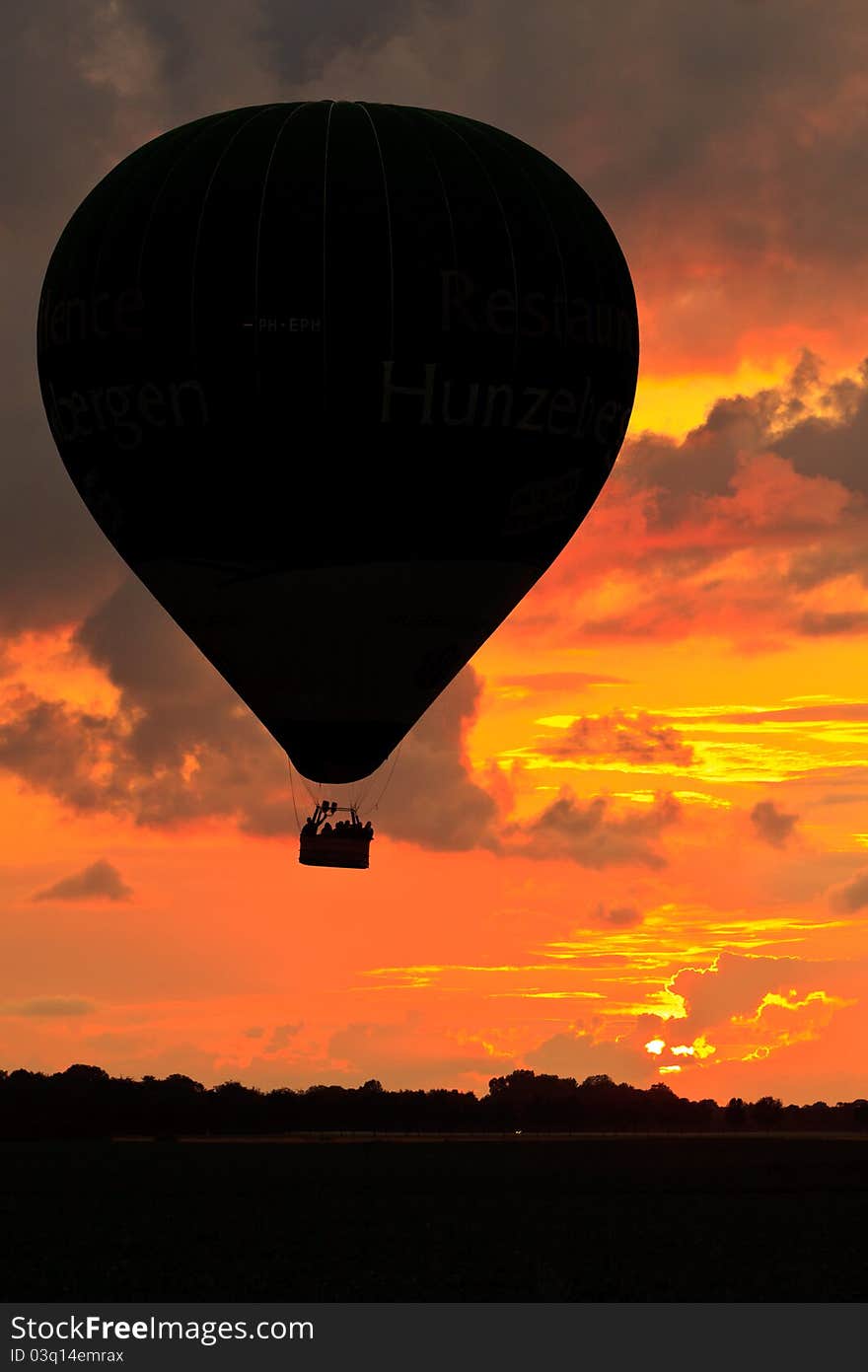 Hot air balloon in the sky at sunset