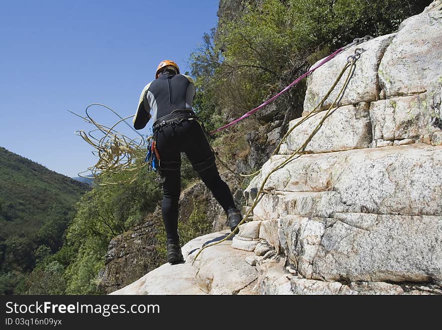 Adventure men fix the rope for your safety. Adventure men fix the rope for your safety