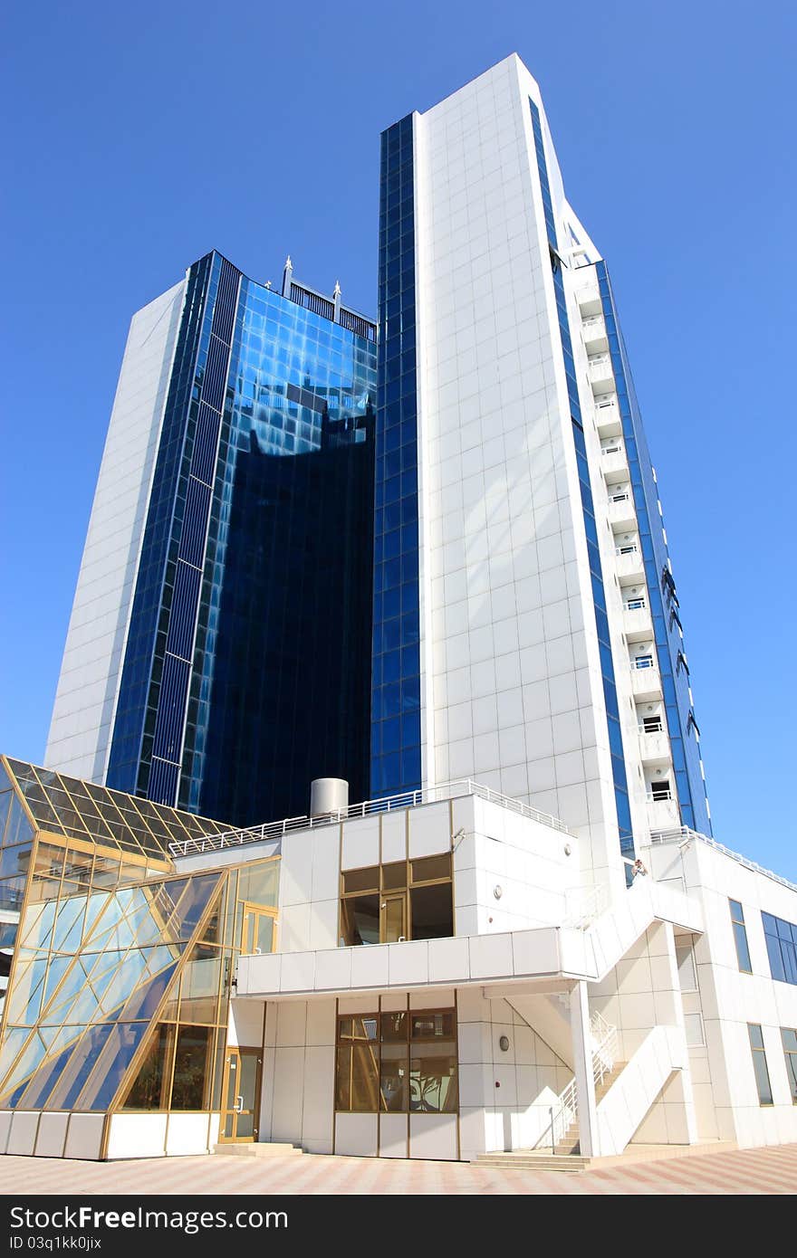 Modern building against blue sky background. Modern building against blue sky background