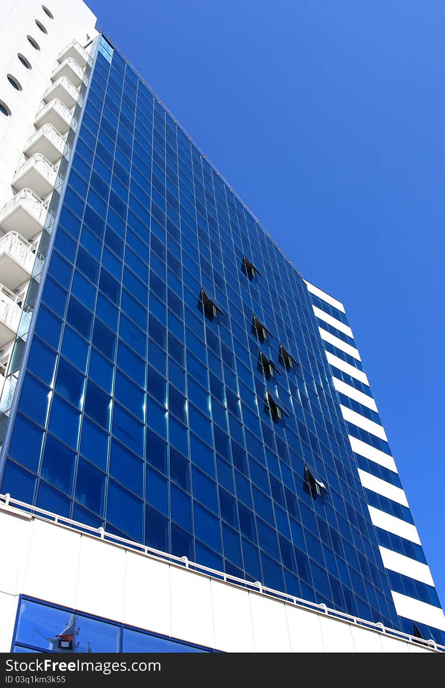 Modern building against blue sky background. Modern building against blue sky background