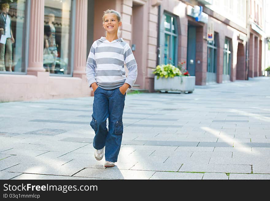 Cute beautiful girl outdoors in city street. Cute beautiful girl outdoors in city street