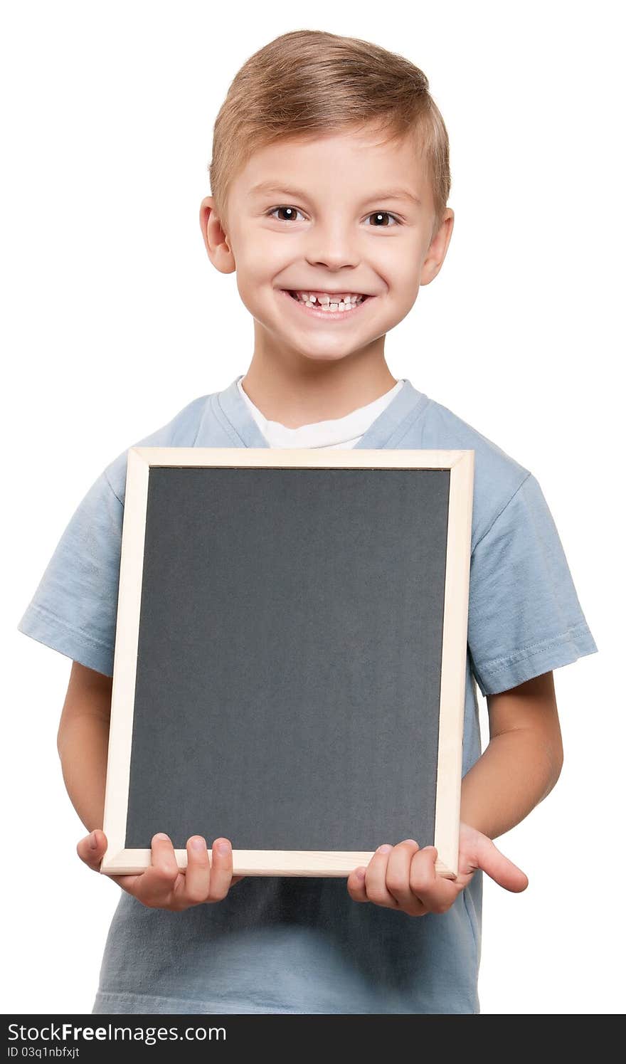 Portrait of a little boy holding a blackboard over white background. Portrait of a little boy holding a blackboard over white background