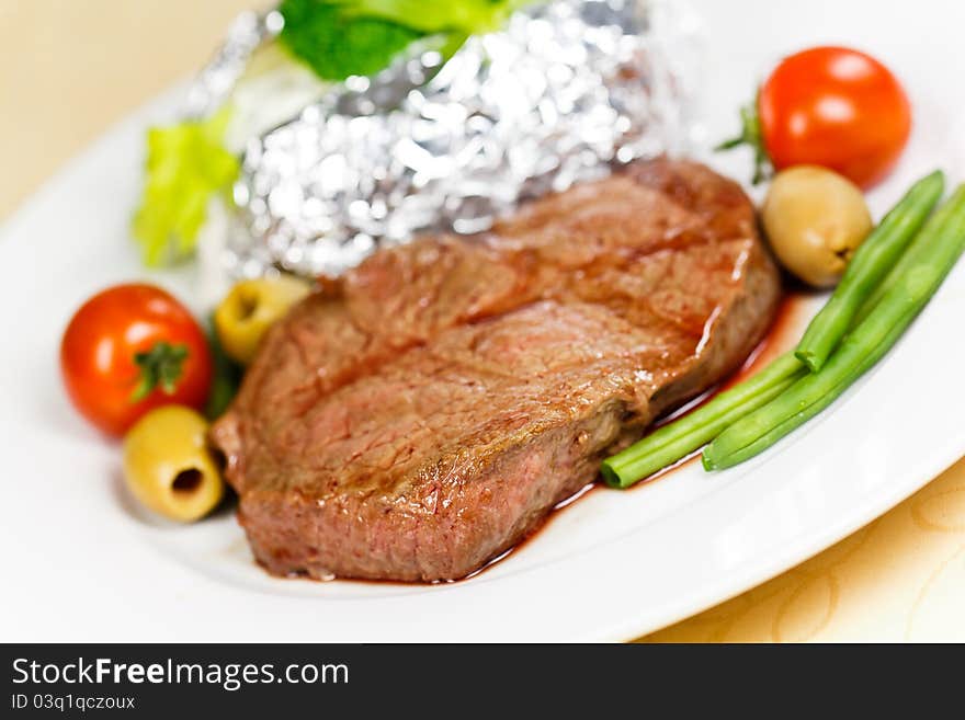 Grilled New York Strip Steak with Vegetables .