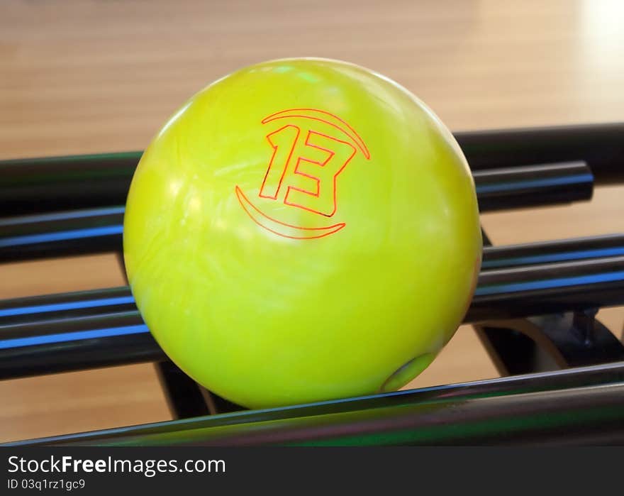 Yellow bowling ball number thirteen