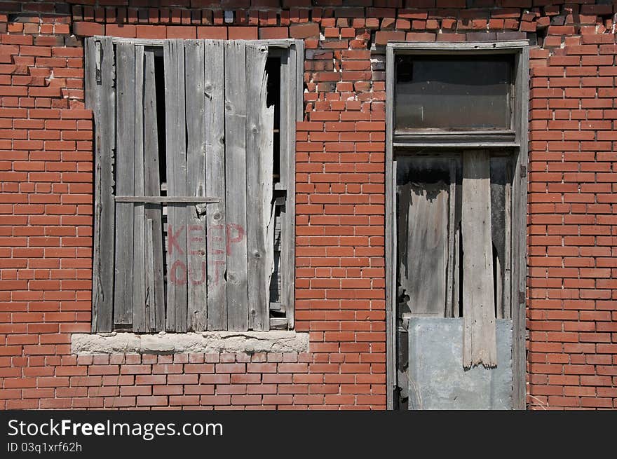 The words “Keep Out” painted on an old, abandoned building in Keota, Colorado.