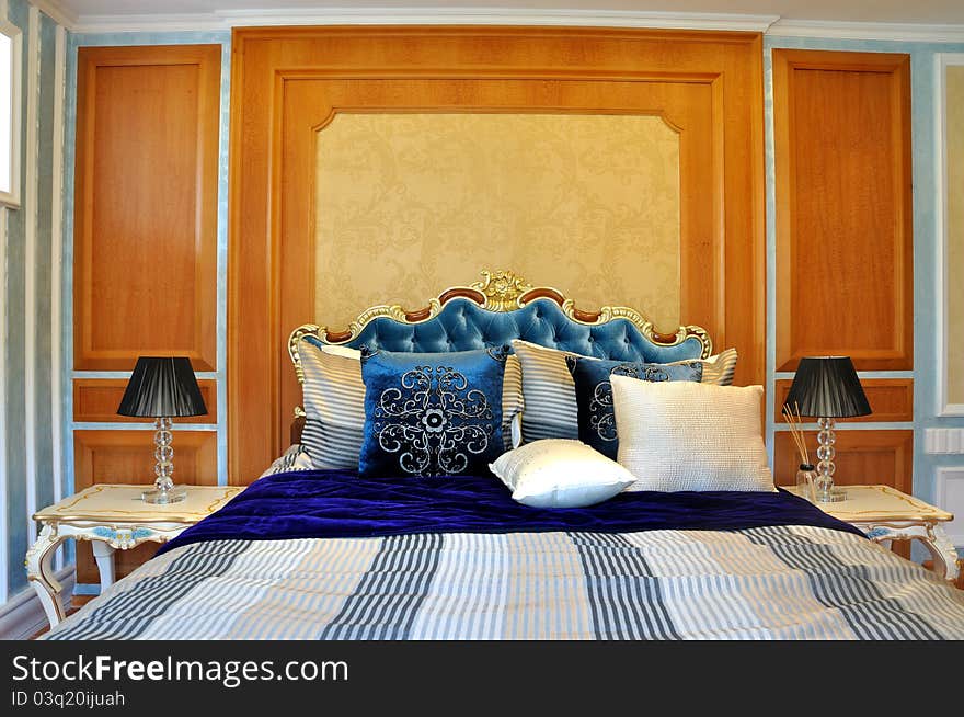 Lively and interesting color matching decoration bedroom internal, with yellow and brown wall and blue bedding. Lively and interesting color matching decoration bedroom internal, with yellow and brown wall and blue bedding.