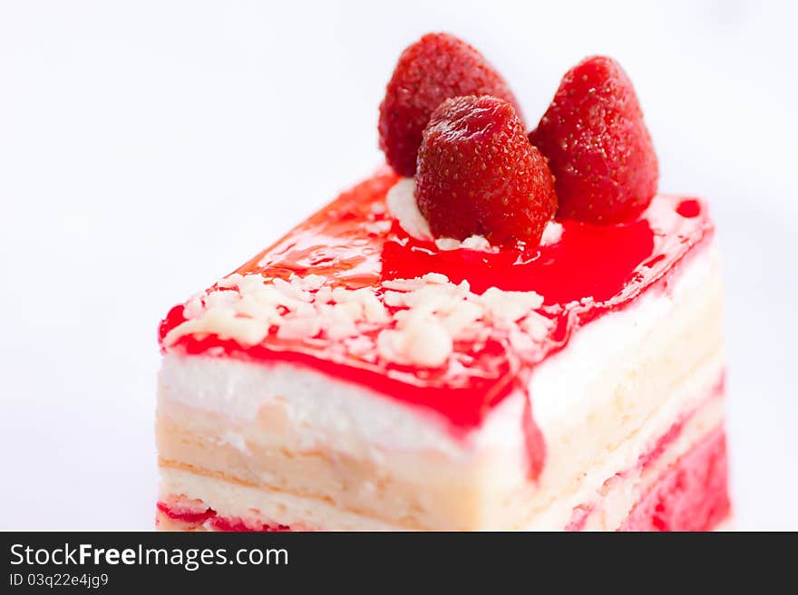 Almond strawberry cake isolated on white background