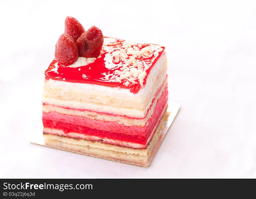 Almond strawberry cake isolated on white background