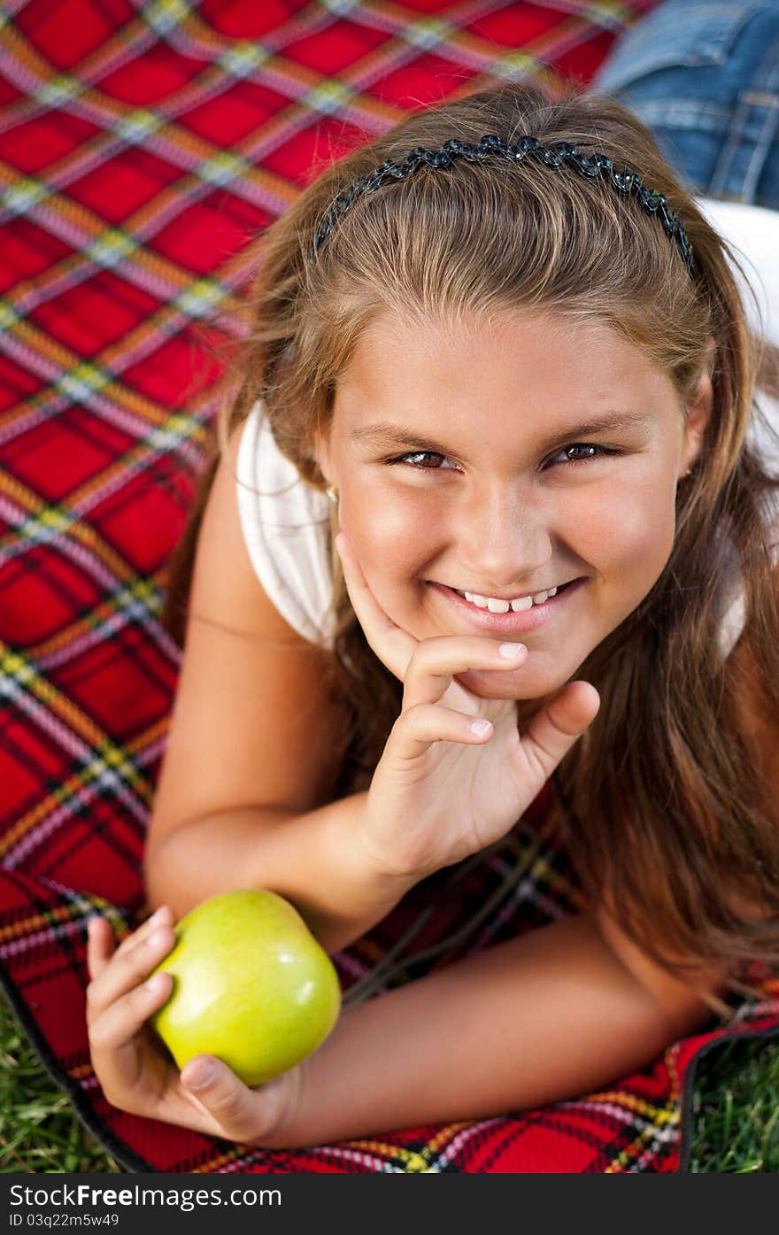 Portrait of little girl with green apple outdoor. Portrait of little girl with green apple outdoor