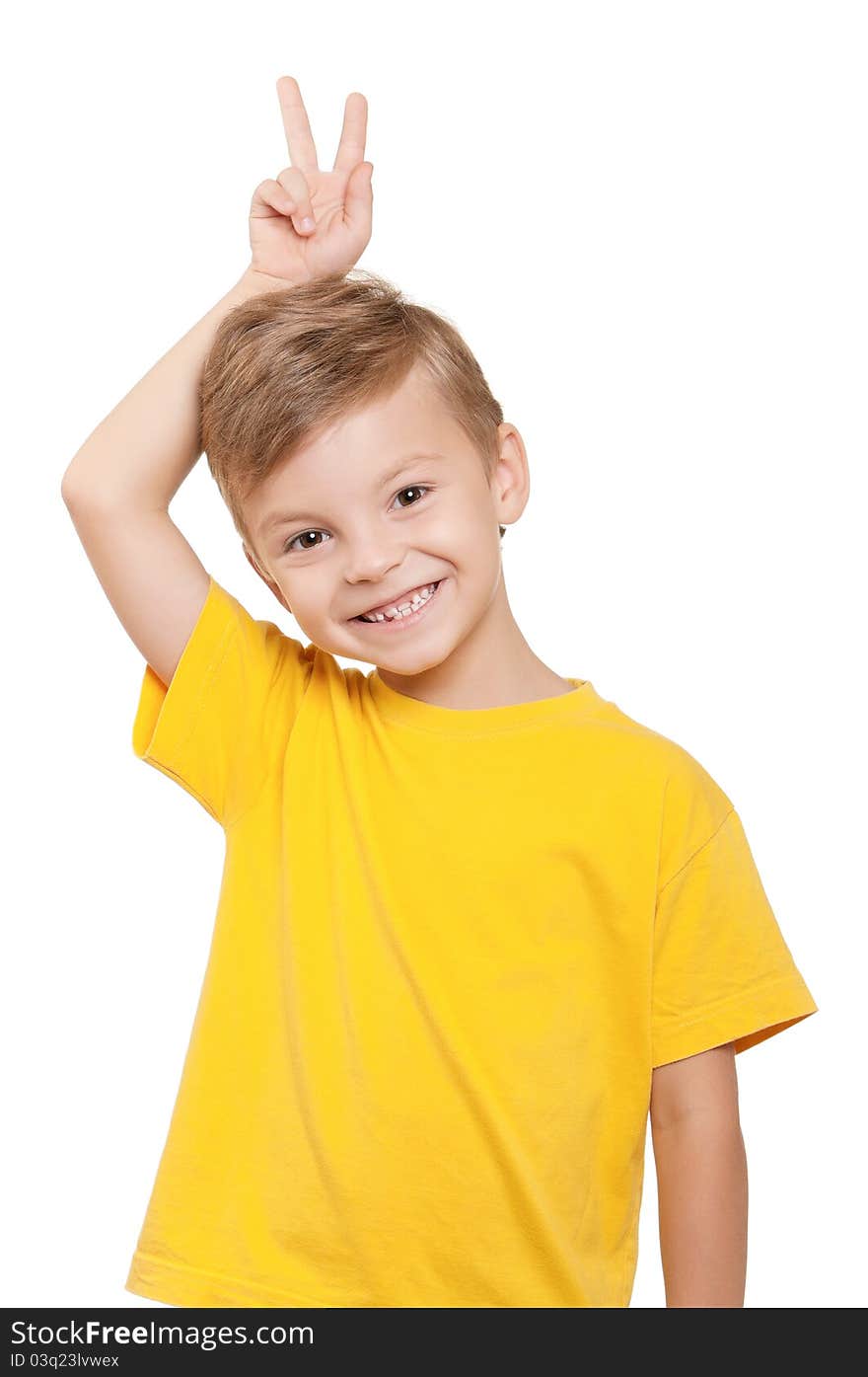 Portrait of little boy keeping two fingers above head over white background. Portrait of little boy keeping two fingers above head over white background