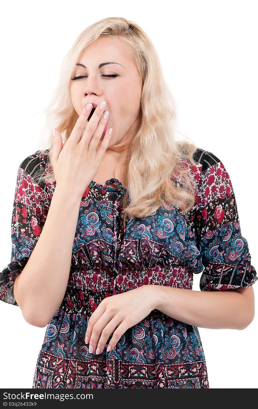 Portrait of a tired young woman yawning - isolated on white background. Portrait of a tired young woman yawning - isolated on white background