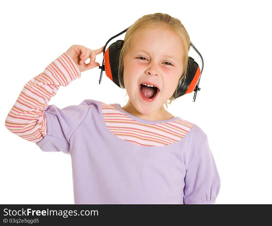 Little girl listening to music on white background