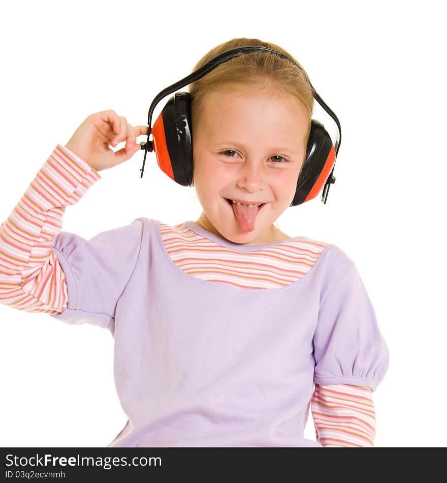 Little girl listening to music on white background