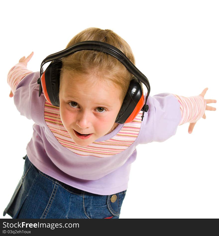 Little girl listening to music on white background