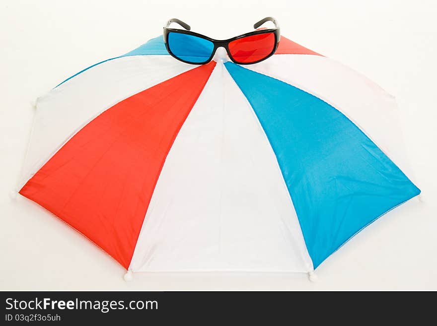 Glasses and an umbrella on a white background.