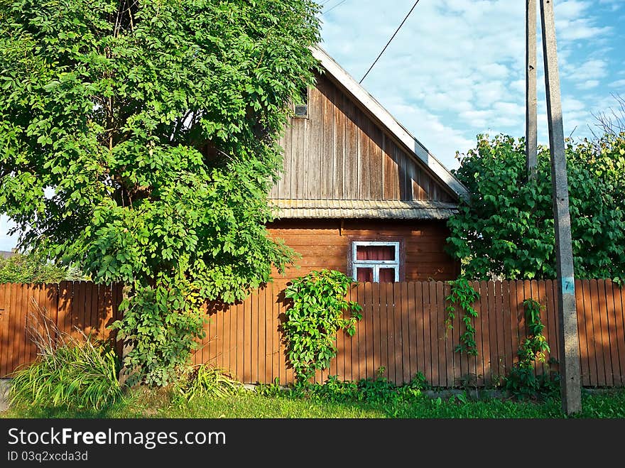 Old a wooden cottage in the countryside, in Podlasie, Poland, Europe. Old a wooden cottage in the countryside, in Podlasie, Poland, Europe