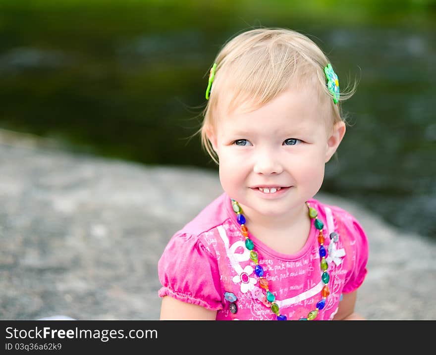 A beautiful little girl outdoors. A beautiful little girl outdoors