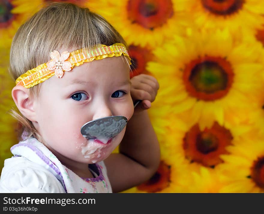 Child eating with big spoon. Child eating with big spoon