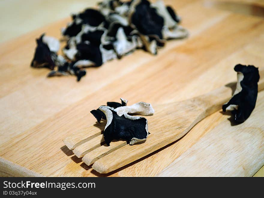 Dried Cloud Ear Fungus On A Wood Background