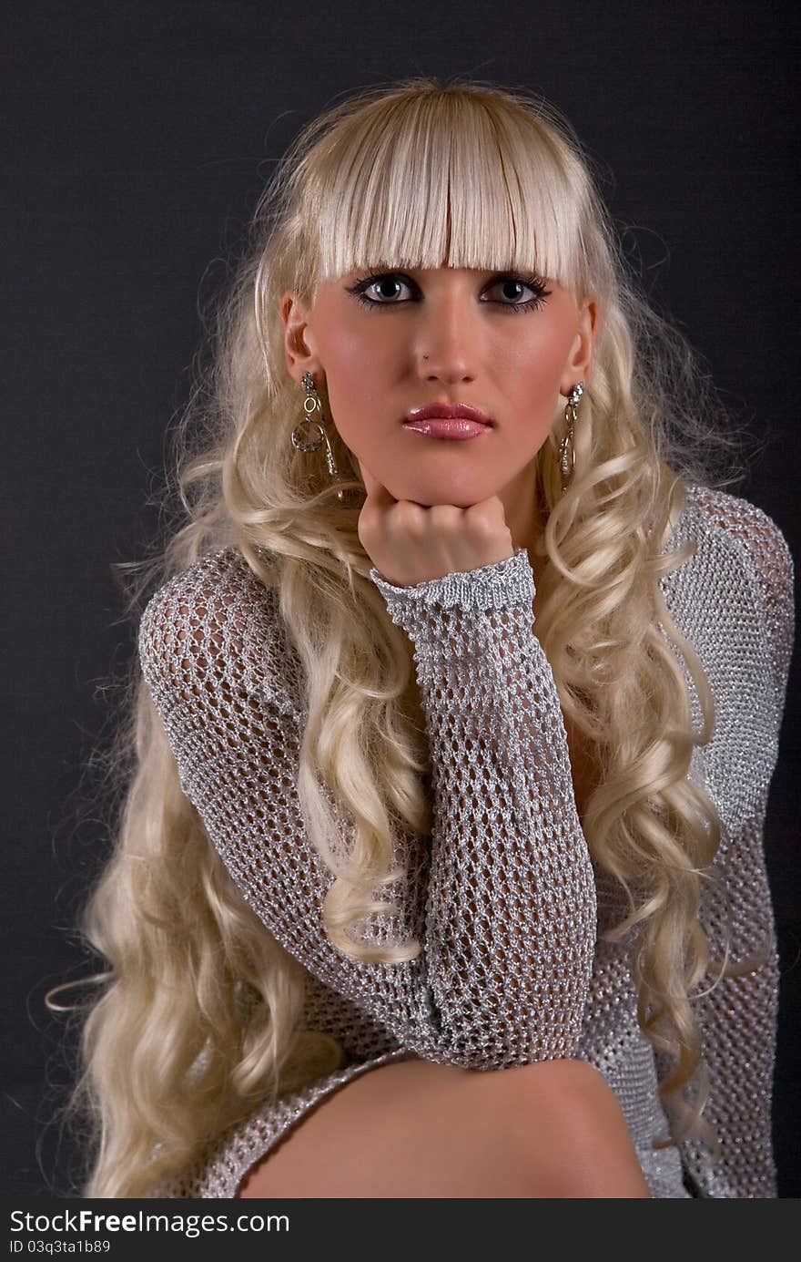 Glamour portrait of the girl on a gray background