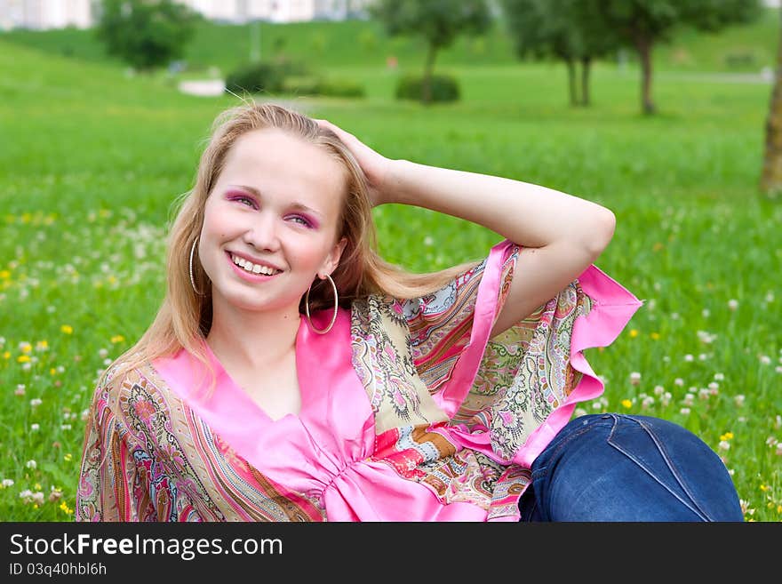 Portrait of a pretty girl in a meadow, a summer day