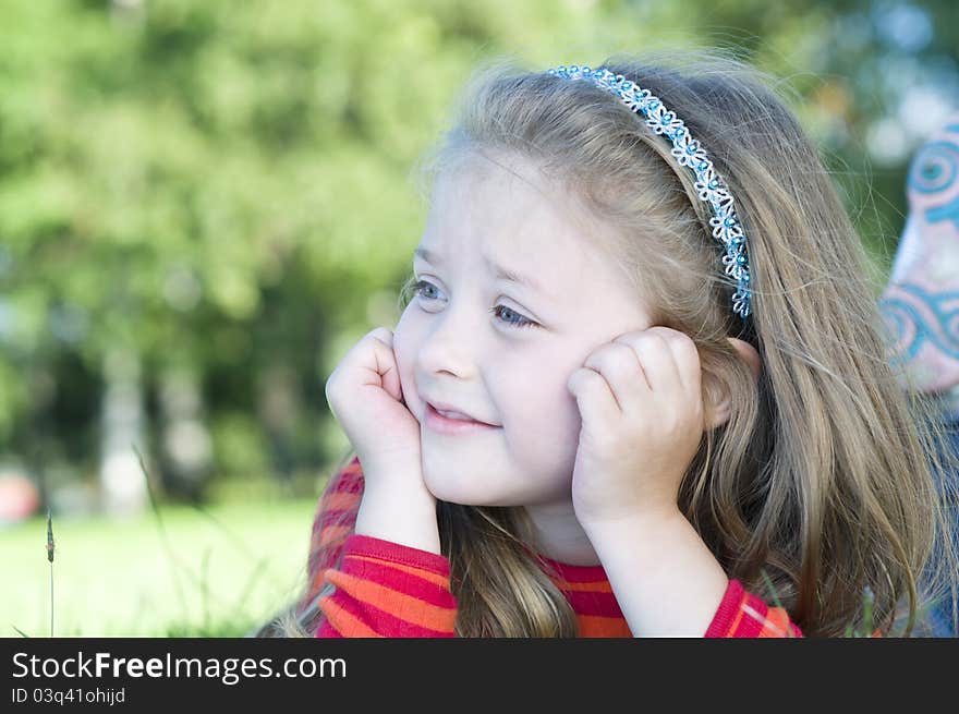 Portrait of little girl in the park