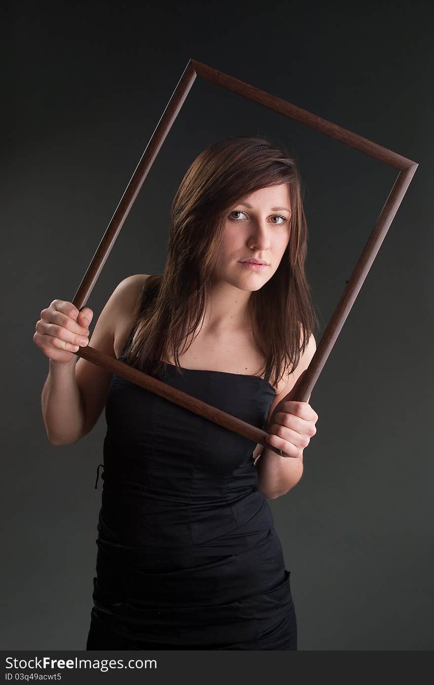 Studio shot of girl with picture frame