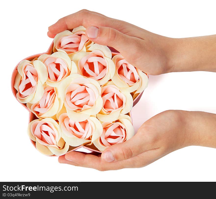 Flower shaped box with flowers in girl hands