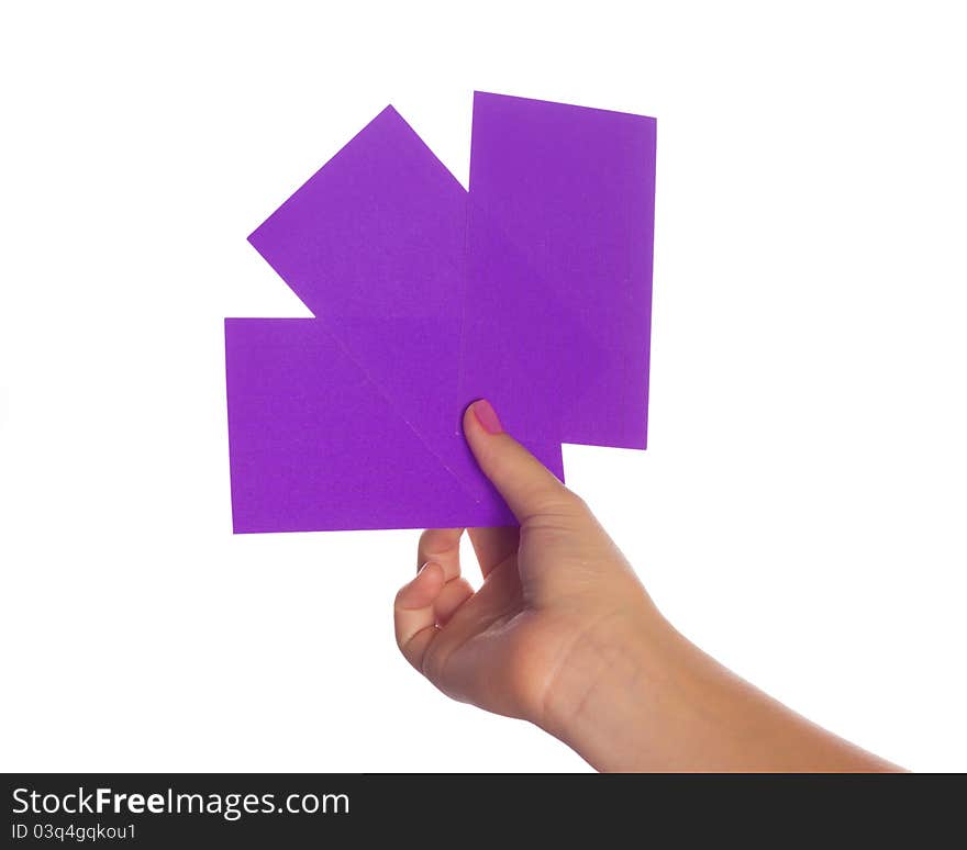 A hand holding three colorful paper index cards. A hand holding three colorful paper index cards