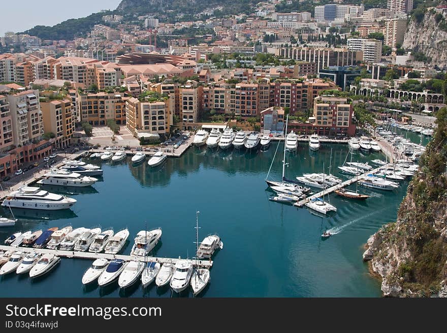 A view of Fontvieille marina in Monaco, surrounded by buildings