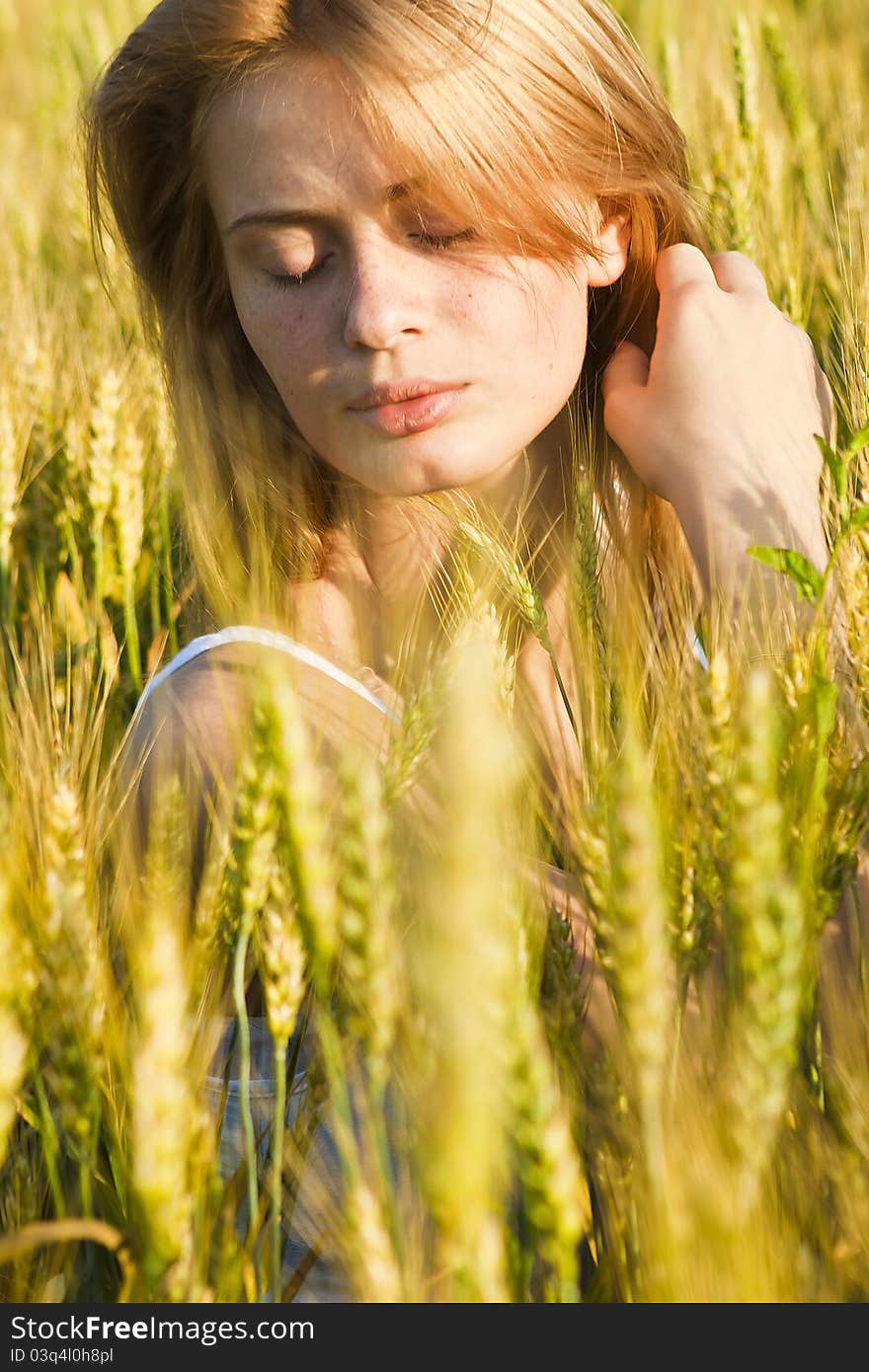 A beautiful woman walks across the field. A beautiful woman walks across the field