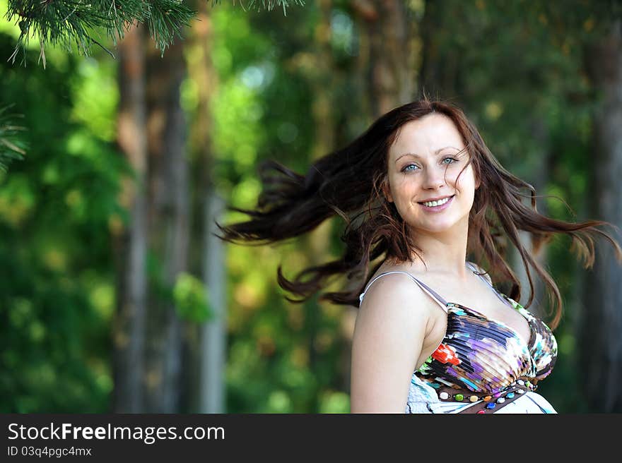 Beautiful woman standing near tree. summer's day. Beautiful woman standing near tree. summer's day.