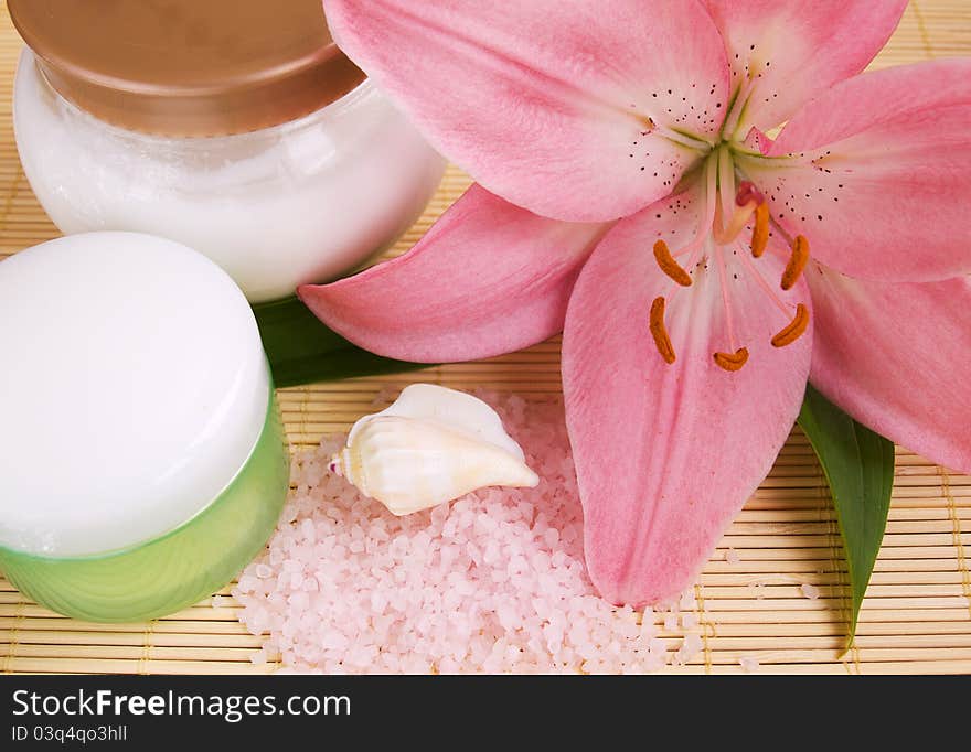 Pink lily, herbal sea salt, cream and seashells. Pink lily, herbal sea salt, cream and seashells