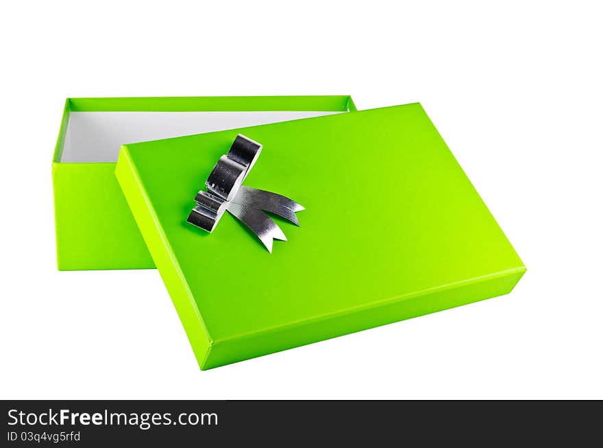 An opened green gift box with silver ribbon