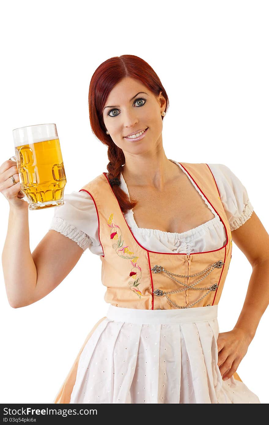 Redheaded bavarian female holding a Glass of Beer wearing a Dirndl