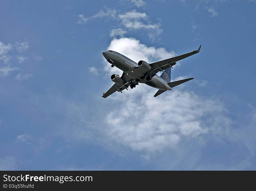 An airplane flying in the sky and preparing to land. An airplane flying in the sky and preparing to land