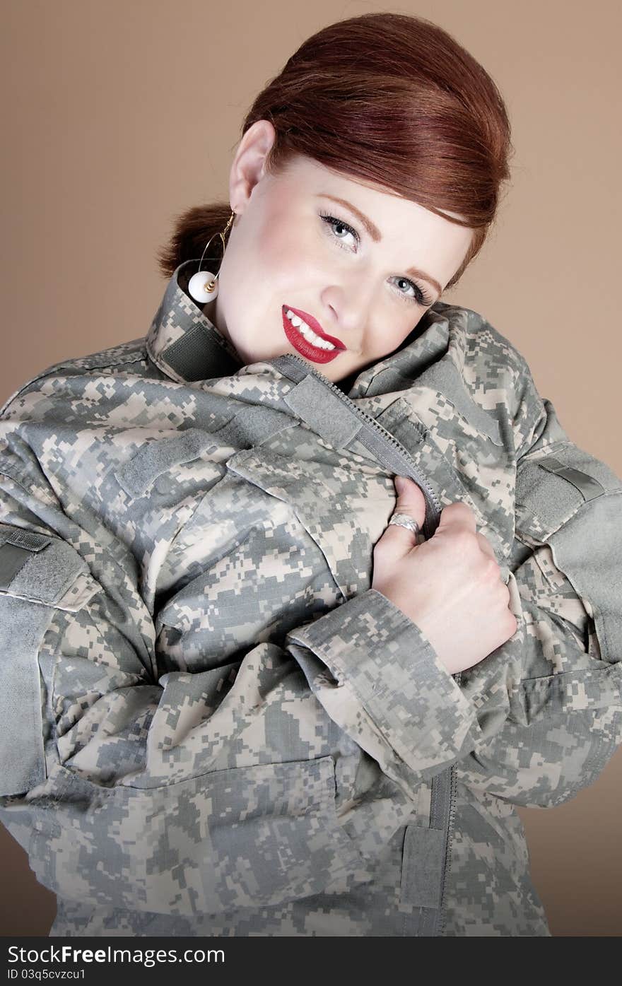 Gorgeous red head woman wearing lover's military jacket. Gorgeous red head woman wearing lover's military jacket