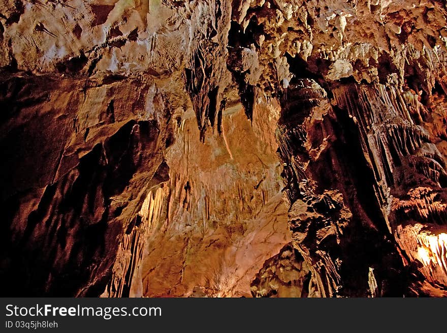 Cave interior with stalagmites and exotic colors