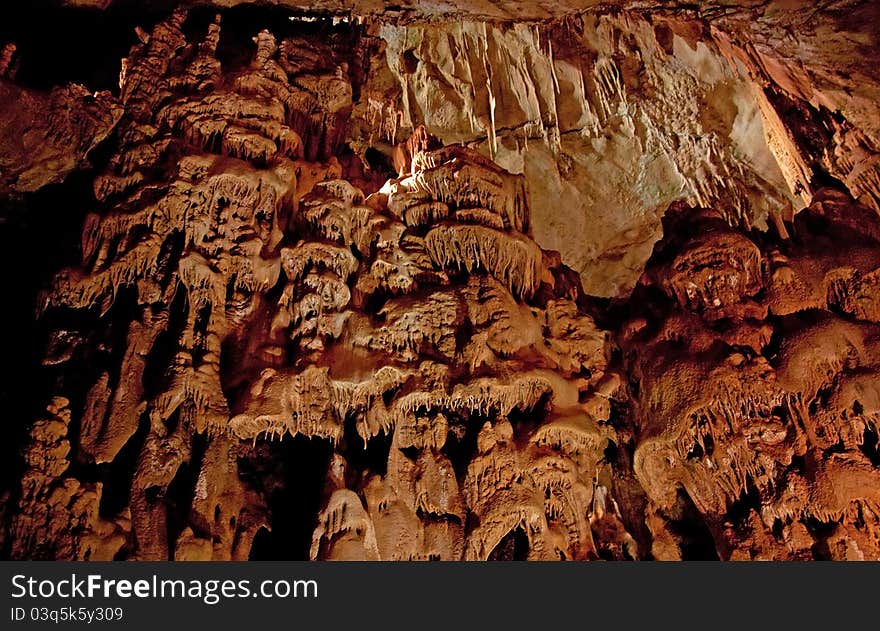 Cave interior with stalagmites and exotic colors