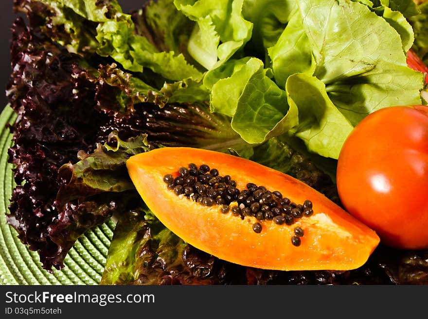 Composition of fruits and vegetables lettuce, tomato, papaya