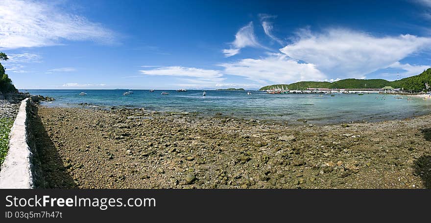 Panorama Sand beach on rocky coast line