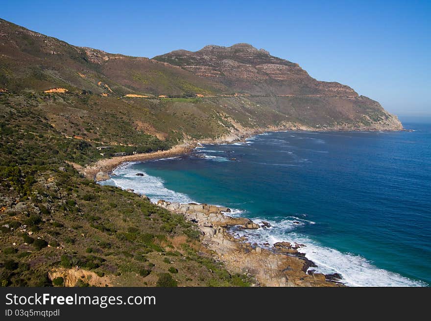 A scene of mountain and ocean along South Africa's coast. A scene of mountain and ocean along South Africa's coast