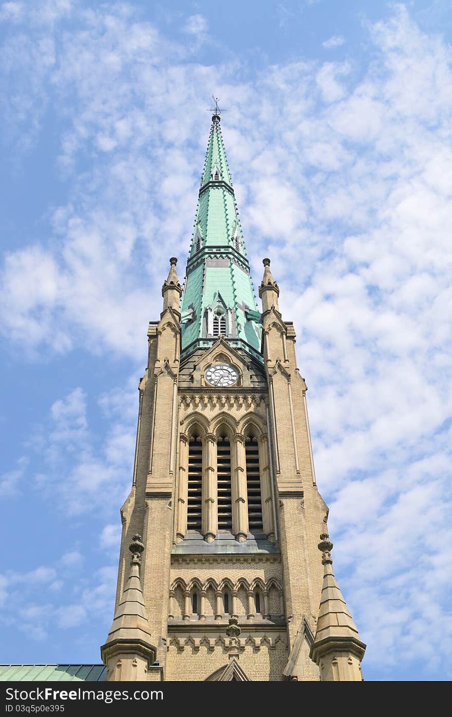 Large outstanding sky ward tower with old looking styled clock. Large outstanding sky ward tower with old looking styled clock