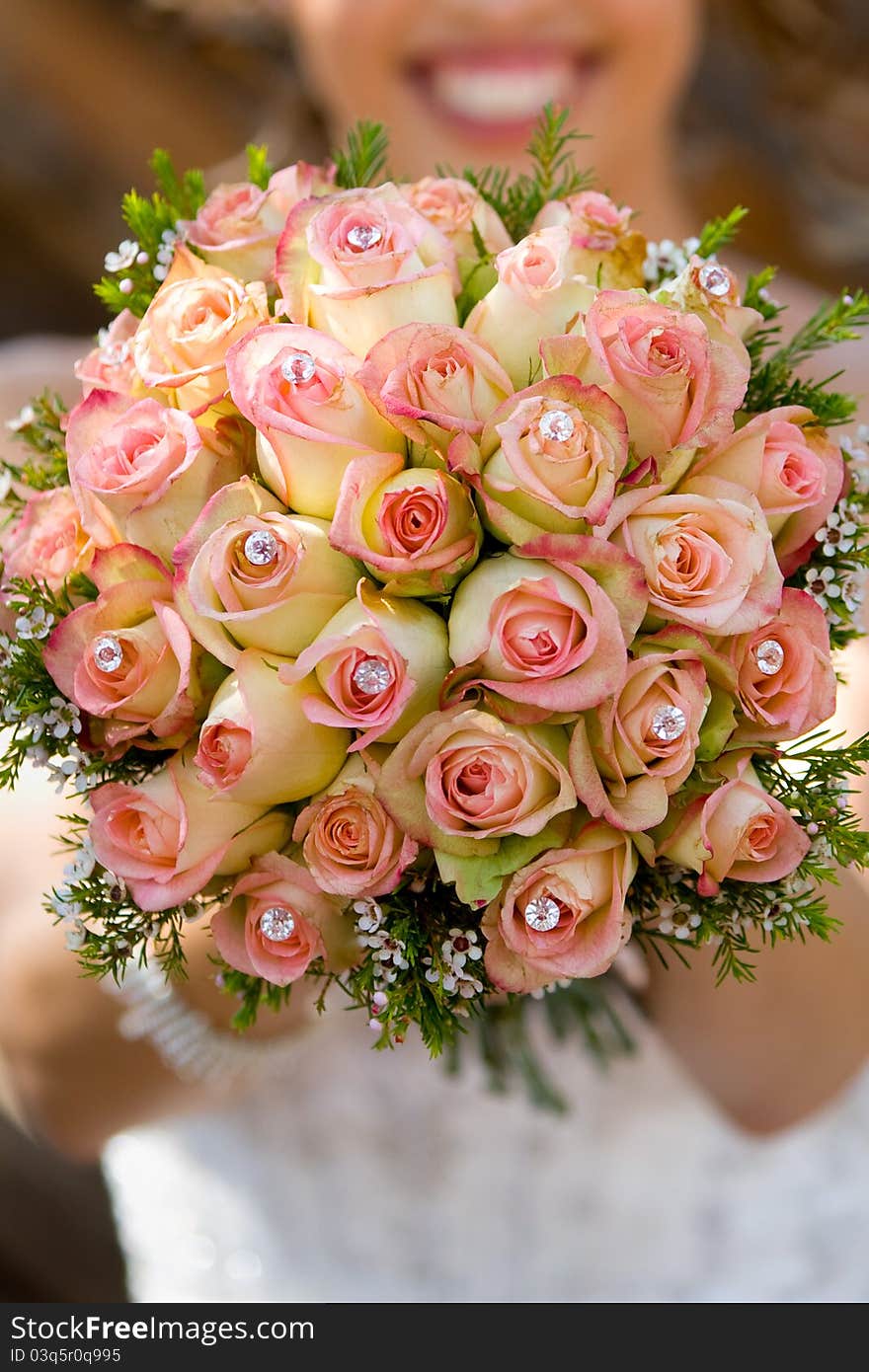 A close up of a pin and yellow rose bouquet