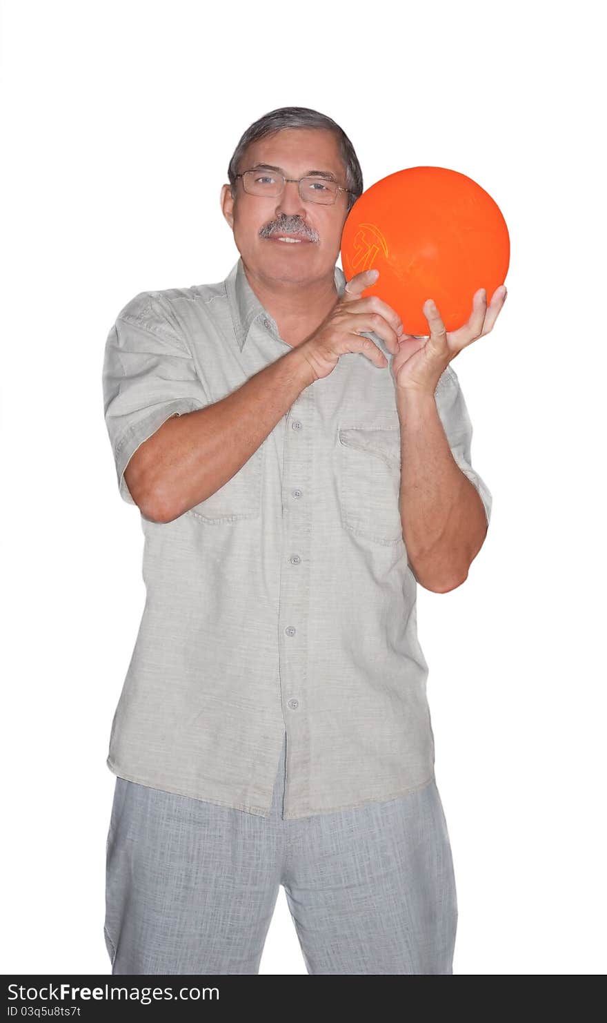 Senior man holding orange bowling ball isolated on white background. Senior man holding orange bowling ball isolated on white background