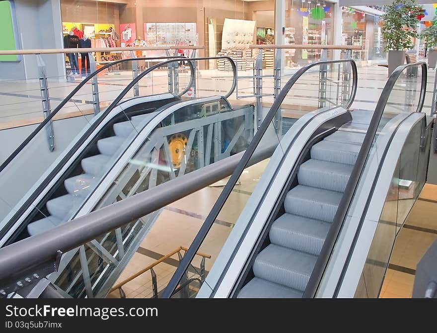 Two escalators in a shopping mall. Two escalators in a shopping mall