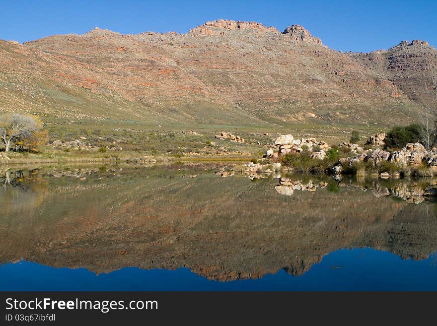 A beautiful mountain reflection in a lake. A beautiful mountain reflection in a lake